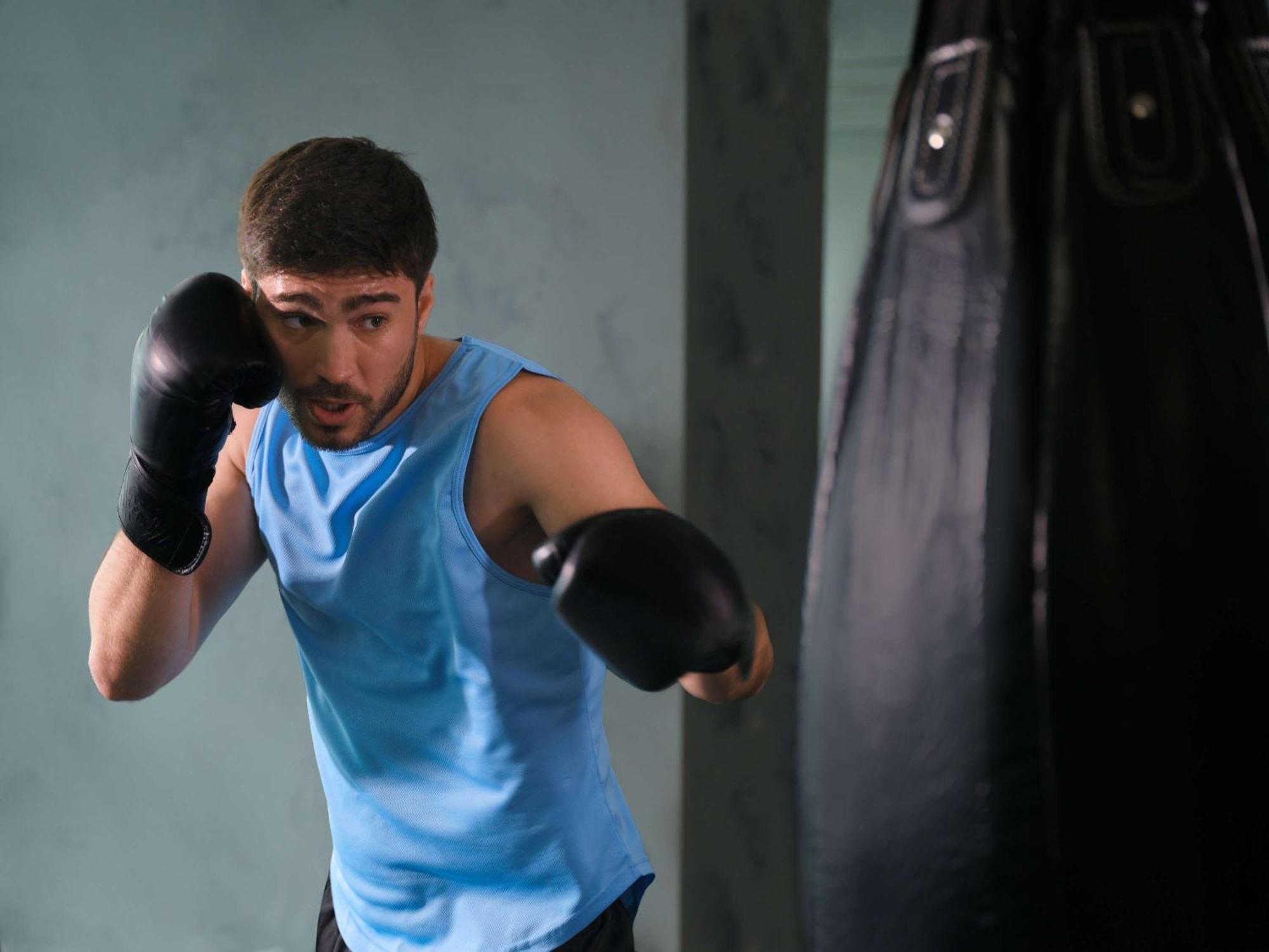 Pullman Jakarta Central Park Exterior foto A boxer training with a heavy bag